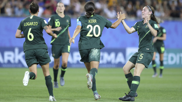 Australia's Sam Kerr, second right, celebrates after scoring her side's second goal against Jamaica.
