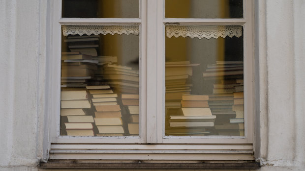 Books piled up in the window of a library in Bavaria. COVID-19 has led to library closures around the world. 