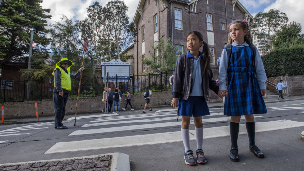 Year 2 students Ashleigh Ho and Victoria Spencer outside Chatswood Public School.