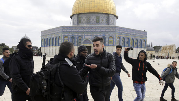 Israeli police confront Palestinians in front of the Dome of the Rock mosque in Jerusalem, last month.