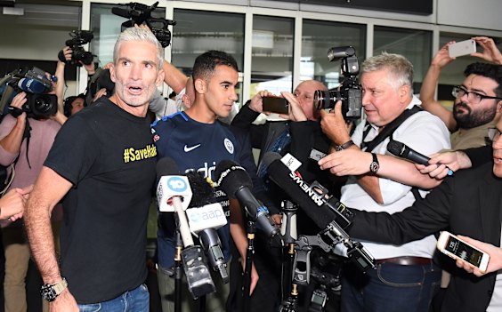 Craig Foster and media flank Hakeem al-Araibi on his return to Australia.