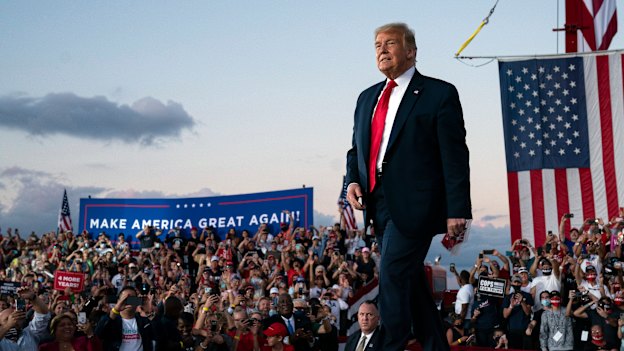 President Donald Trump arrives for a campaign rally at Orlando Sanford International Airport on Monday.