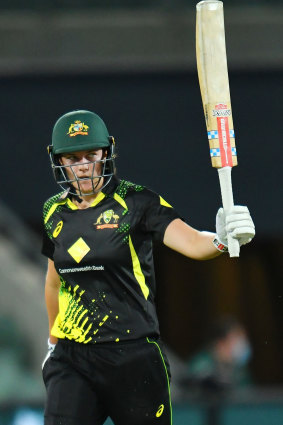 Tahlia McGrath raises the bat during her match-winning knock.