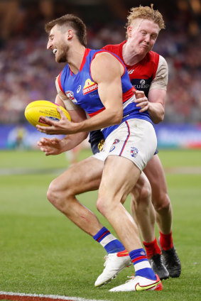 Clayton Oliver tackles Marcus Bontempelli in last year’s grand final