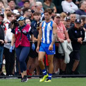 Jy Simpkin is taken off the ground on Sunday following the heavy hit he copped from St Kilda’s Jimmy Webster.