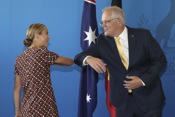 Australian of the Year Grace Tame and Prime Minister Scott Morrison share an elbow bump in Canberra in January.