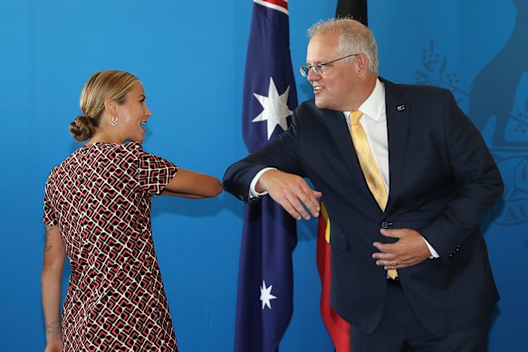 Australian of the Year Grace Tame and Prime Minister Scott Morrison share an elbow bump in Canberra in January.