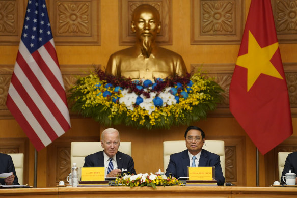 US President Joe Biden and Vietnam’s Prime Minister Pham Minh Chinh attend a business roundtable meeting in Hanoi, Vietnam, on Monday.