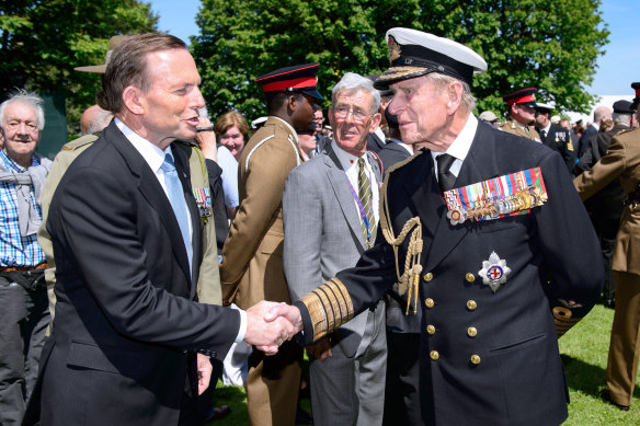 Former PM Tony Abbott with Prince Philip in 2014; the following year, he granted the British royal a knighthood on Australia Day. 