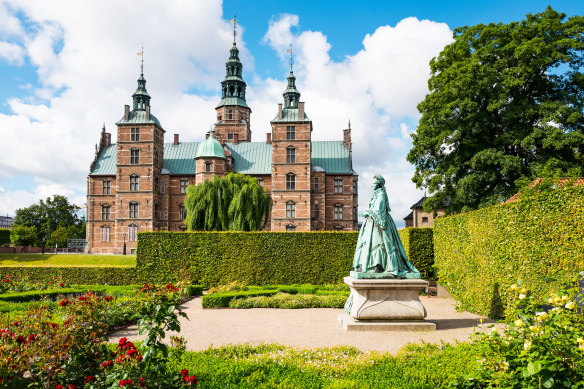 The garden around Copenhagen’s Rosenborg Castle, featuring a statue of Queen Caroline Amalie.