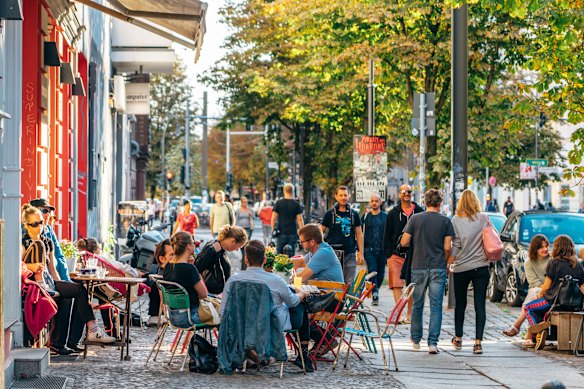 Street life in Prenzlauer Berg, once home to boarded-up windows, now one of Berlin’s best addresses.