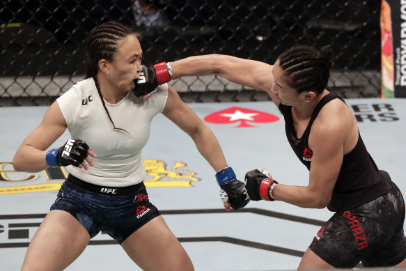 Carla Esparza, right, lands a punch on Michelle Waterson during UFC 249 on Saturday in Jacksonville.