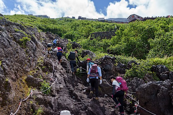 Hikers ascend Mount Fuji.