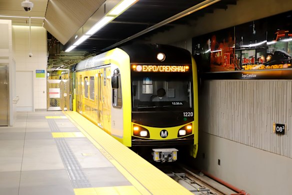 The Metro K Line (Pink Line) train arrives at Expo/Crenshaw Station.