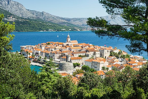 The Croatian medieval old town of Korčula is towered over by mountainous Pelješac Peninsula.