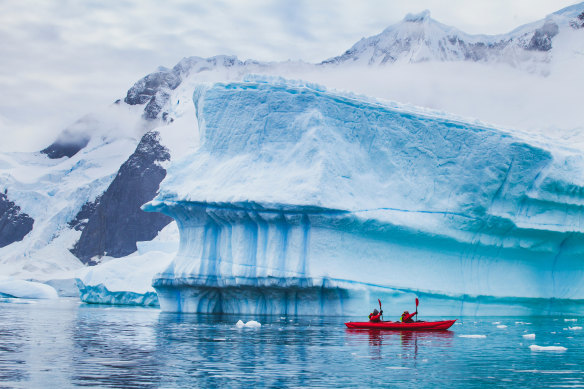 Kayaking through icy waters.