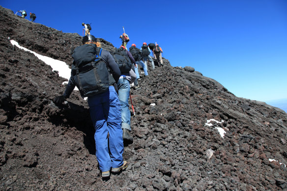 Tourists hike up Villarrica, one of Chile’s most active volcanos.