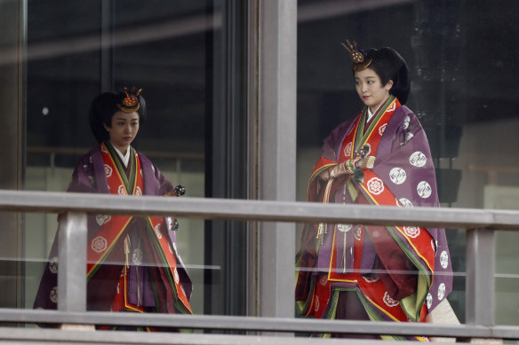 Japan's Princess Kako and Princess Mako arrive for a ceremony to proclaim Emperor Naruhito's enthronement to the world.