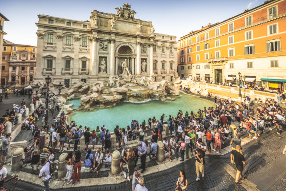A crowded Trevi Fountain, Rome.