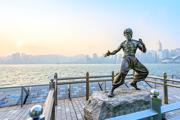 Pose with action movie legend Bruce Lee.