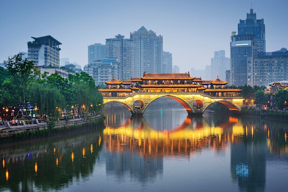 Anshun Bridge, illuminated at dusk, is a major landmark of the Sichuan city of Chengdu, China.