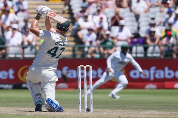 Australia’s Cameron Green smashes the ball toward the boundary.