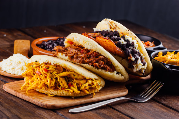 Colombians love the arepa, often  filled with meat, black beans or  fried plantain.