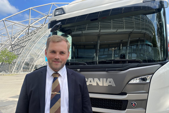 Norway’s transport state secretary, Bent-Joacim Bentzen, in front of an electric truck at the International Transport Forum’s annual summit in Germany.