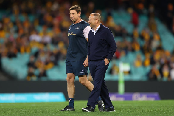 Eddie Jones chats with Wallabies assistant coach Scott Wisemantel, who used to be on England’s staff.