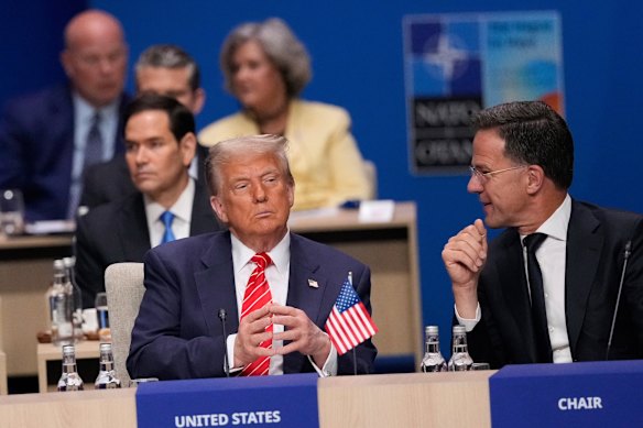 Flattery will get you everywhere: President Donald Trump and NATO Secretary General Mark Rutte at the plenary session.