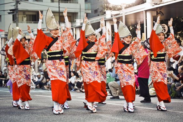 Dancing in the street in a festival of colour. 