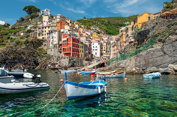 The once relatively undiscovered cliffside trails of Cinque Terre in Italy are increasingly populated with tourists.