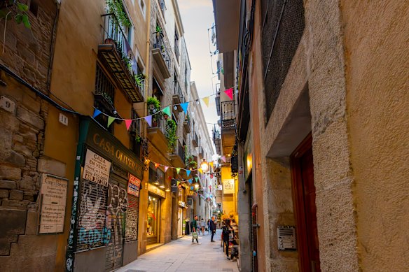 Wander the atmospheric narrow laneways of Carrer del Bisbe in the Gothic Quarter.