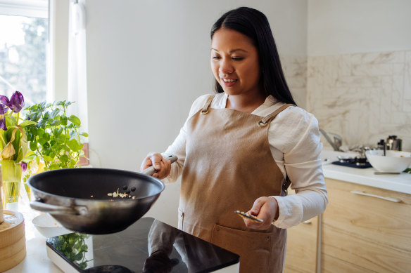 Holding a heavy pan can be an easy way to test your grip strength.