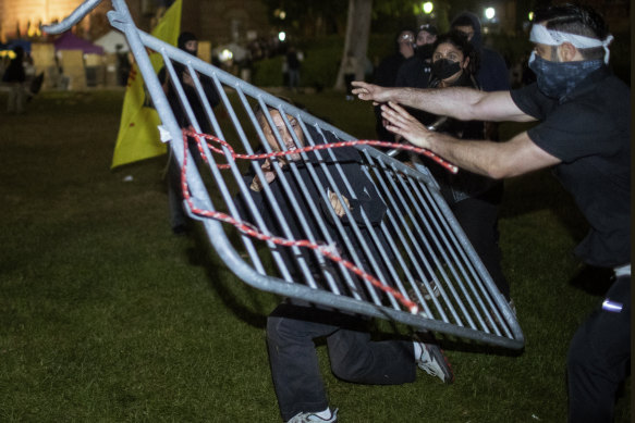 Demonstrators clash at a pro-Palestinian encampment at UCLA on Wednesday.
