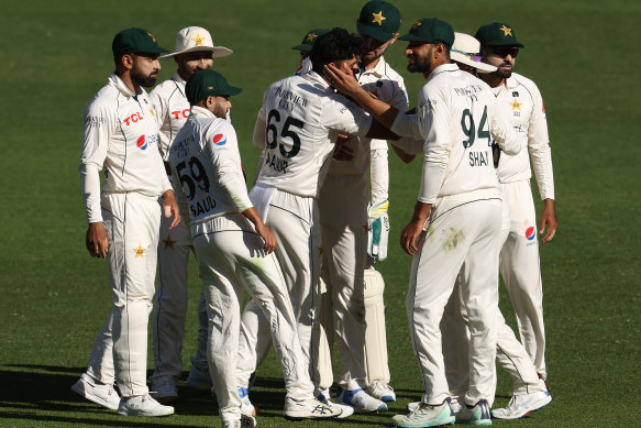 Pakistan celebrate Head’s dismissal.