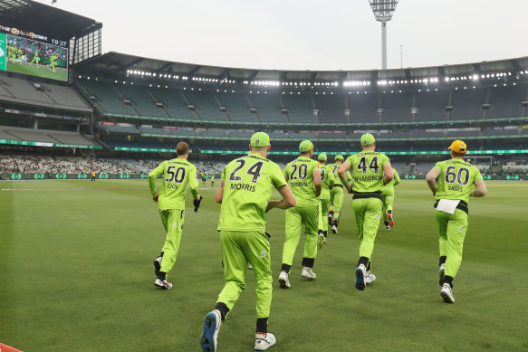 The Thunder take the field at the MCG during a BBL match in 2020.