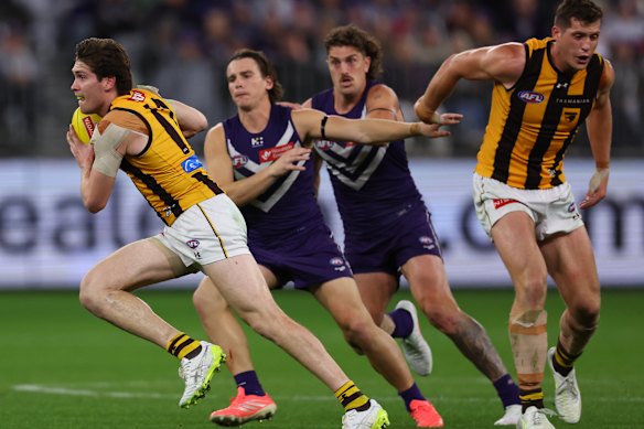Will Day of the Hawks runs with the ball.