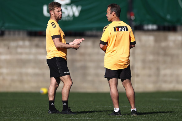 Former premiership Hawk Sam Mitchell with coach Alastair Clarkson.