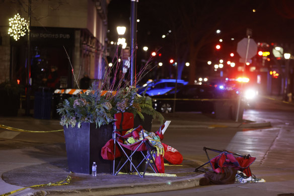 Toppled chairs are seen among holiday decorations in downtown Waukesha after the parade crash.