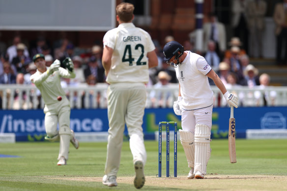 Alex Carey of Australia throws the ball before it hits the stumps to run out Jonny Bairstow of England