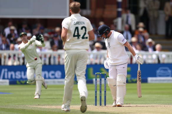 Alex Carey of Australia throws the ball before it hits the stumps to dismiss Jonny Bairstow of England