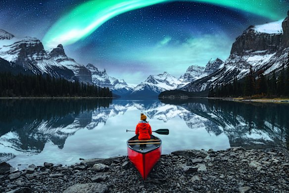 The Aurora Borealis, or Northern Lights, appear over Spirit Island on Maligne Lake in Canada’s  Jasper National Park.