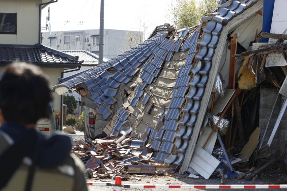 A damaged house following an earthquake in Kunimi, Fukushima prefecture in Japan on Thursday.