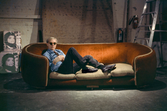 Andy Warhol on the red couch at the Factory, 1964, New York.