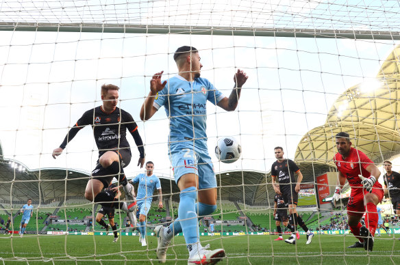 Roar goalkeeper Jamie Young looks on as a deflection off teammate Kai Trewin goes into the back of the net.