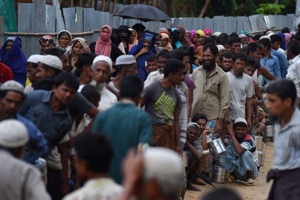Rohingya refugees queue for a meal provided by a Turkish aid agency in the Shofiullah Kata camp, Cox’s Bazar, Bangladesh.