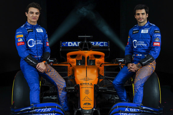 McLaren drivers Lando Norris (left) and Carlos Sainz have taken a pay cut.