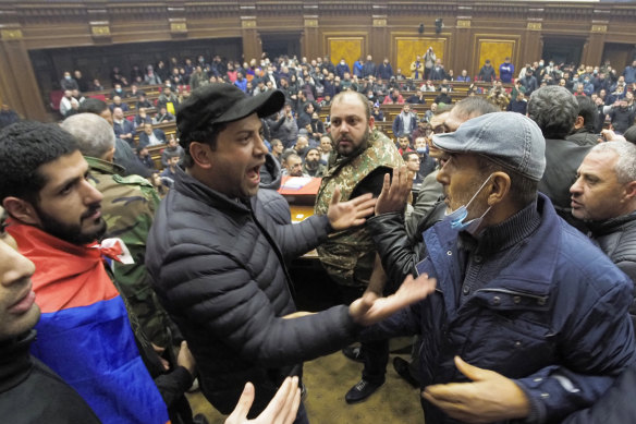 Unhappy with the peace deal, protesters break into parliament in Yerevan, Armenia.