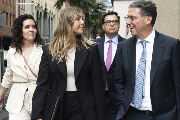 Lurking in the background: Brittany Higgins’ fiance David Sharaz (second from right).